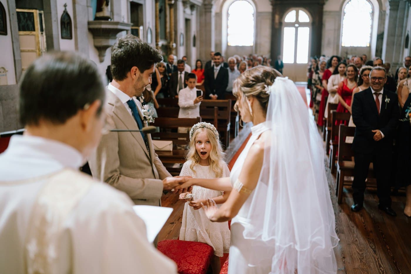 A church ceremony with a flower girl