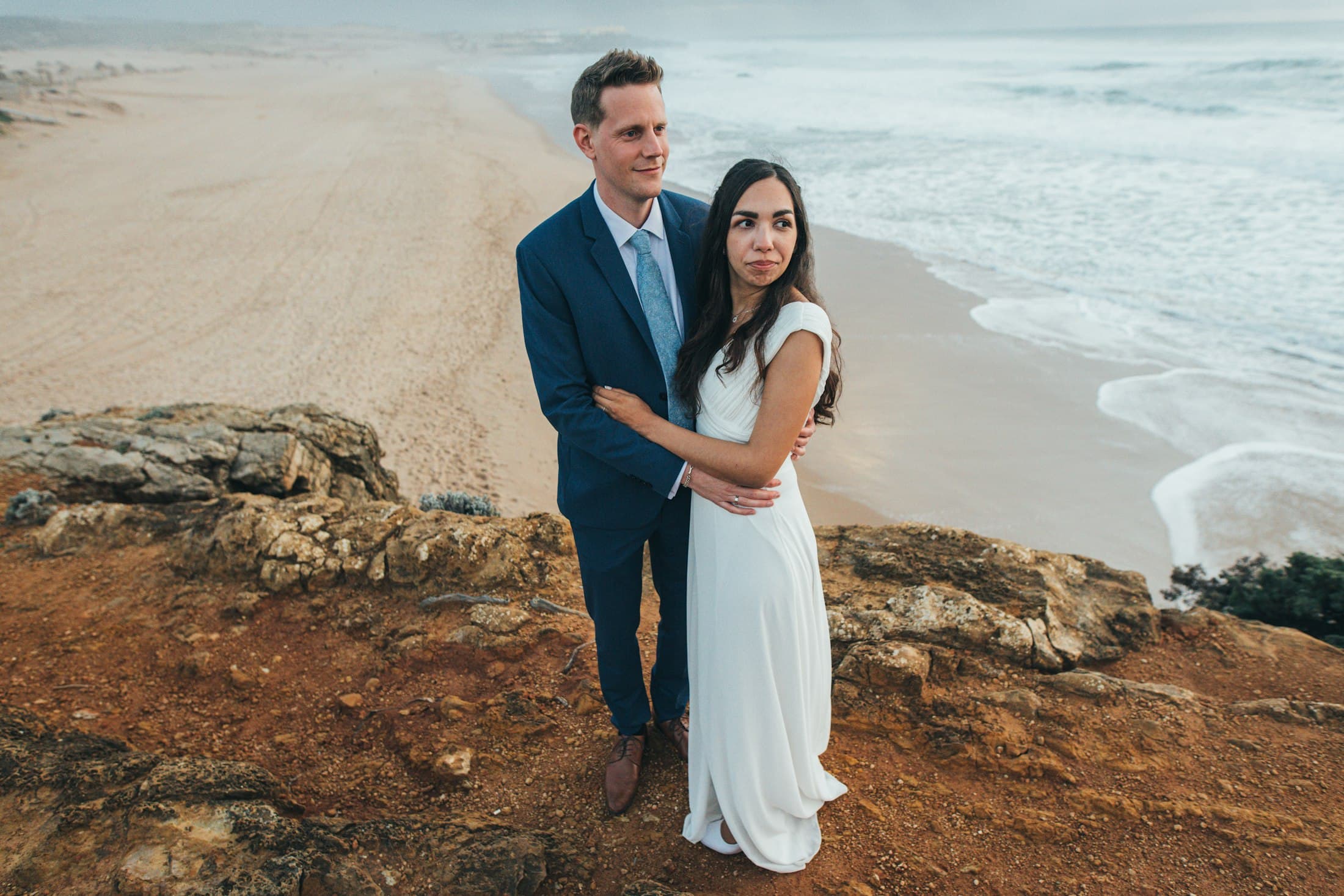 A couple on a cliff edge above the Atlantic, in black and white