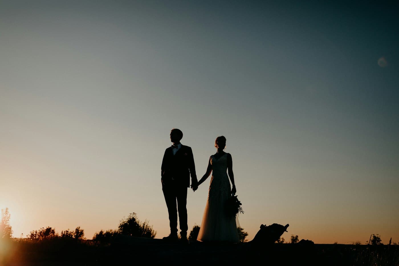 A couple in silhouette at sunset